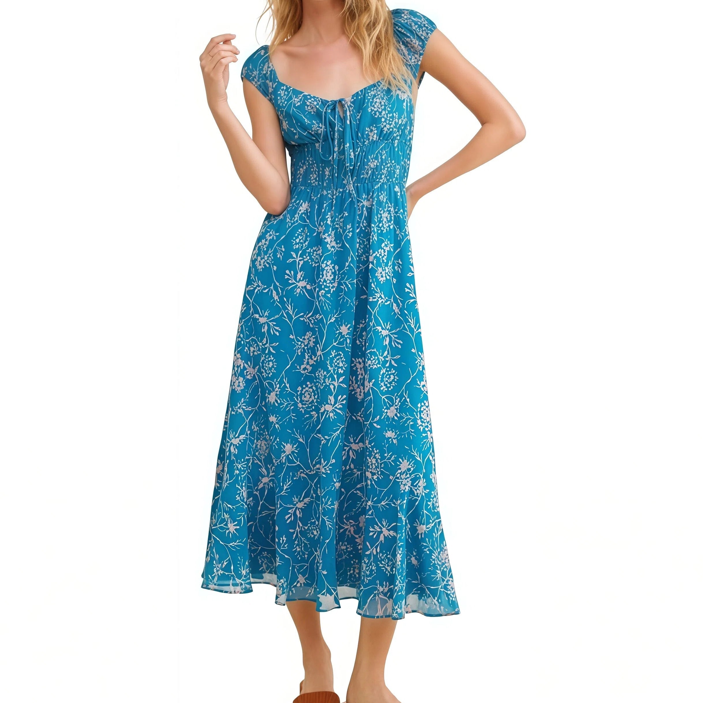 Woman wearing a blue floral dress on a white background