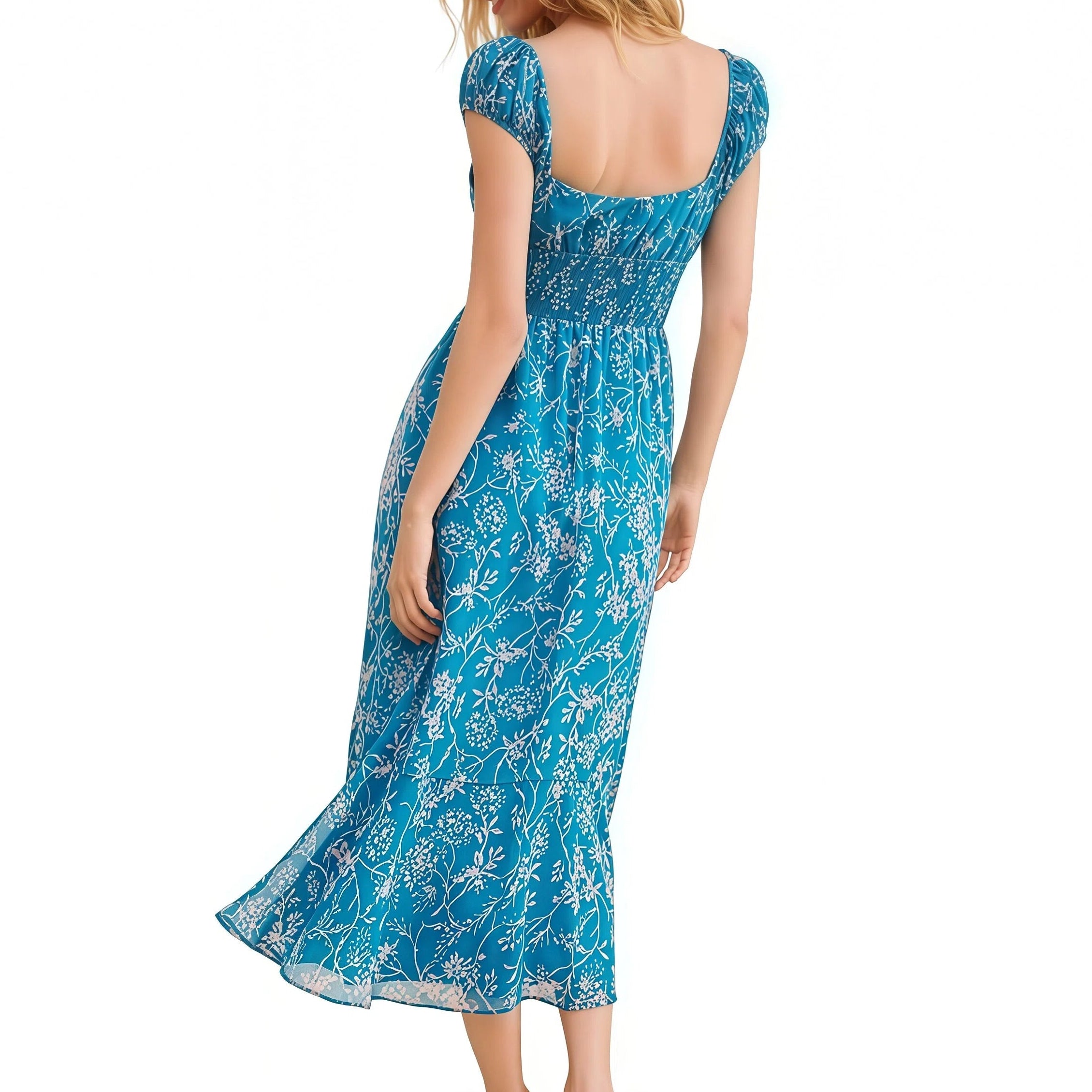 Woman wearing a blue floral dress on a white background