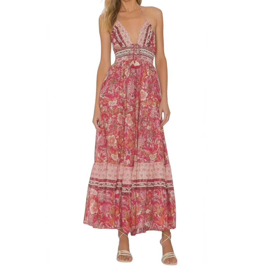Woman wearing a pink floral dress on a white background