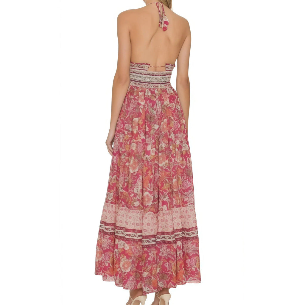 Woman wearing a pink floral dress on a white background