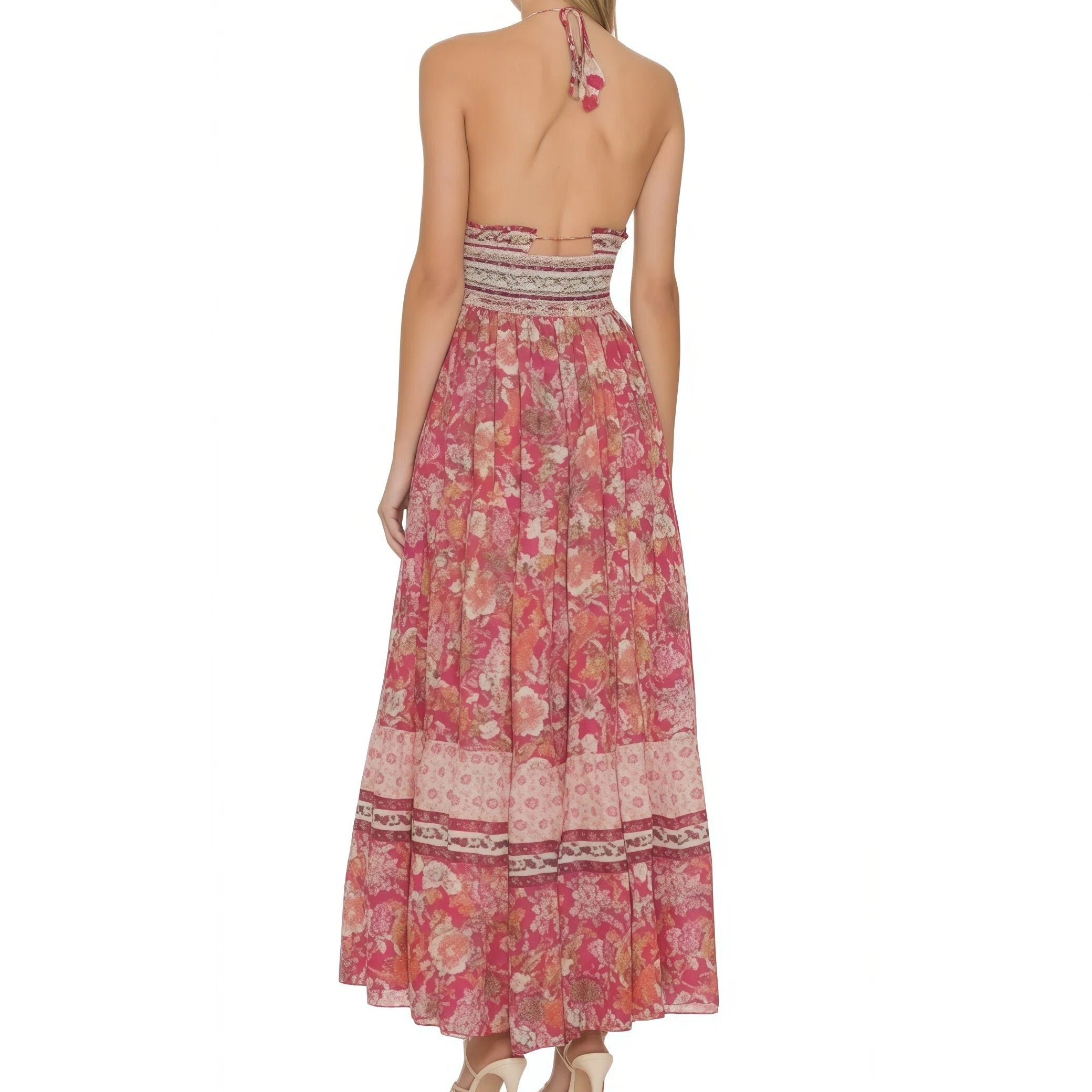 Woman wearing a pink floral dress on a white background