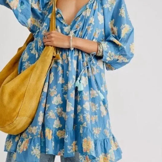 Long sleeved tassel tie ruffled hem mini dress