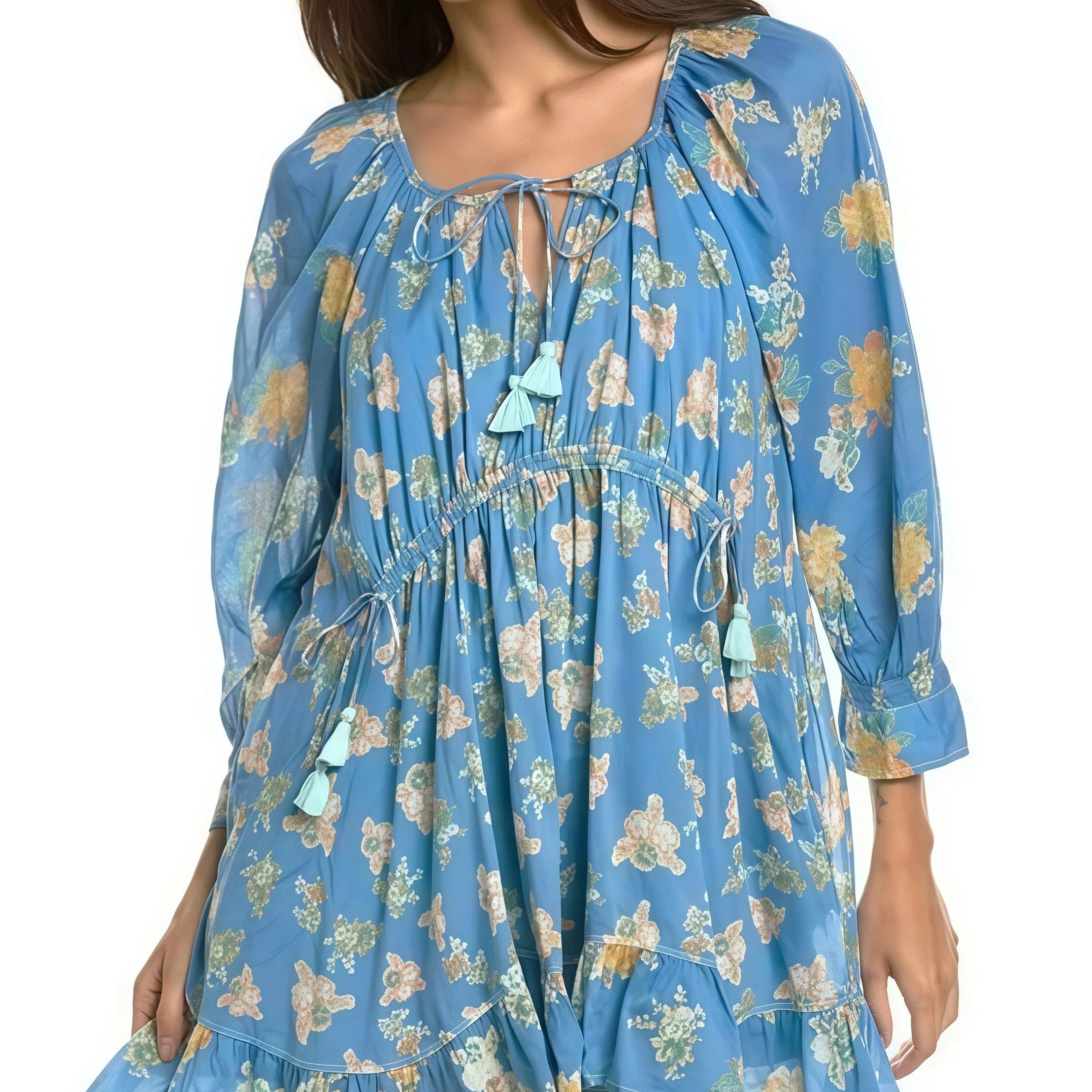 Woman wearing a blue floral dress on a white background