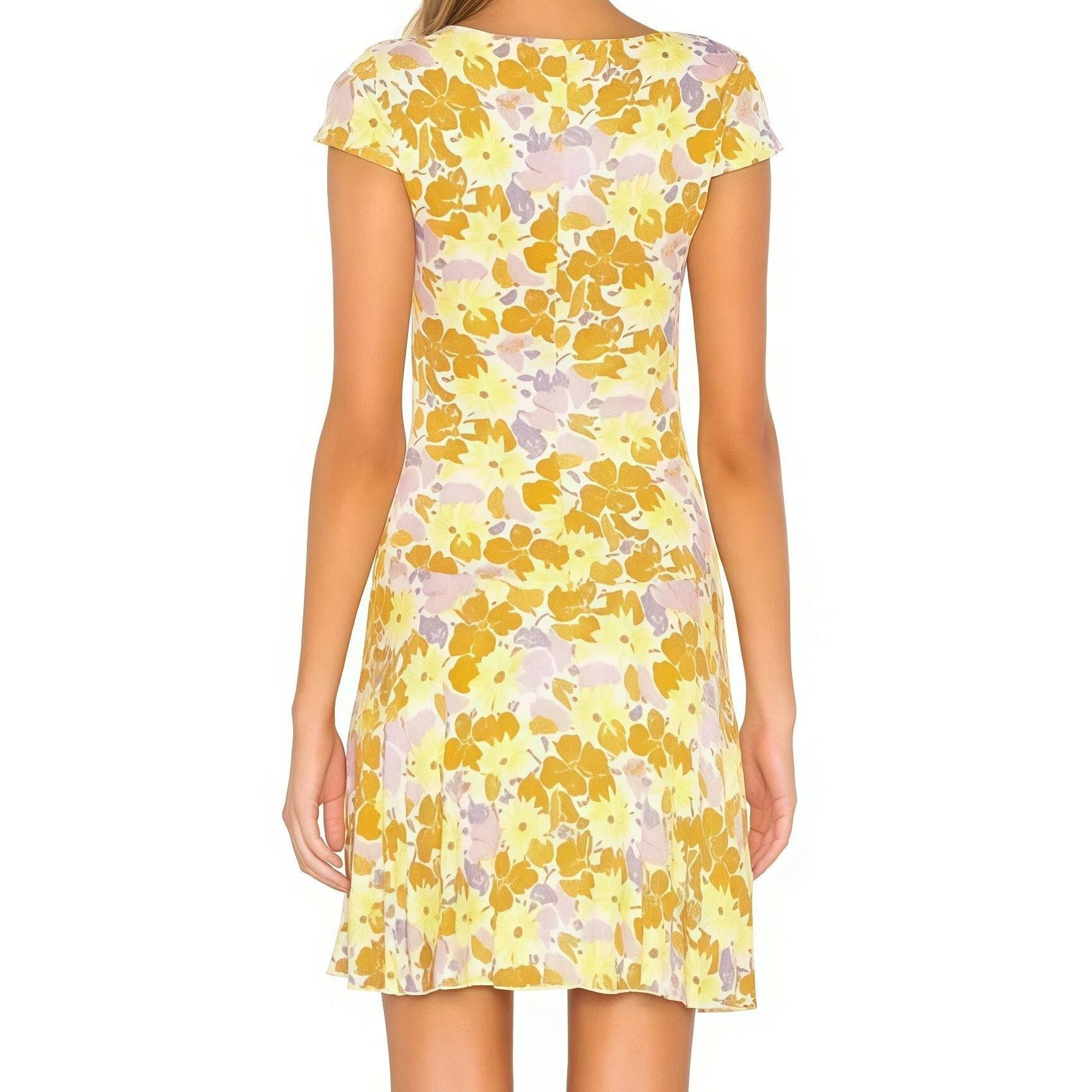 Woman wearing a yellow floral dress on a white background